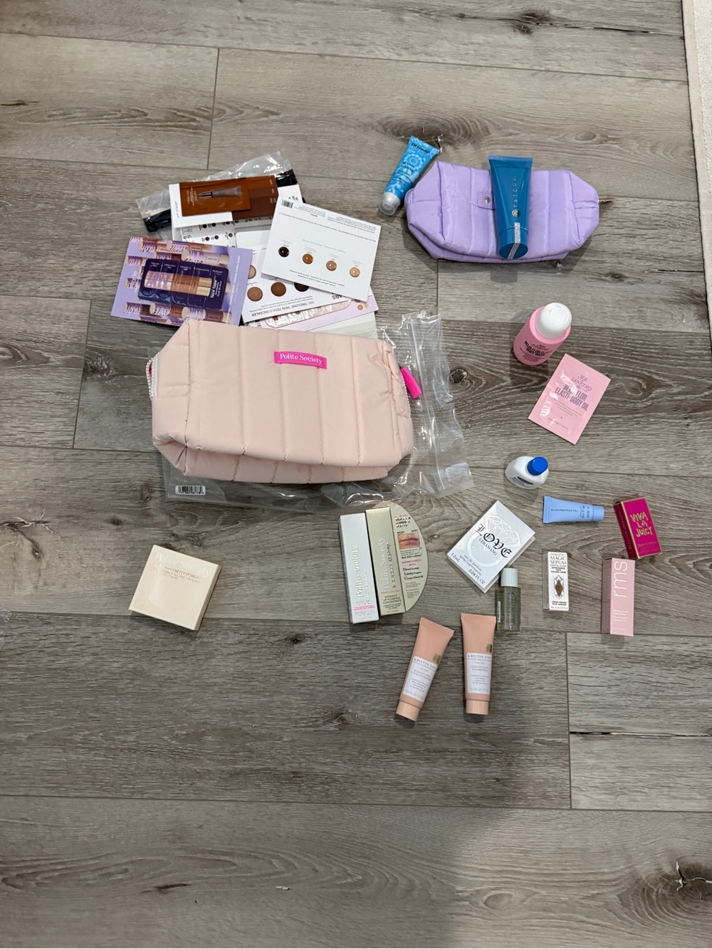Quilted Pink Makeup Pouch with Assorted Travel Skincare Samples and Full Size